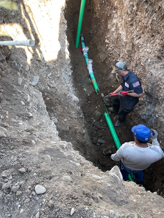 professional plumbers from Rocky Mountain Plumbing & Remodel during water line replacement service