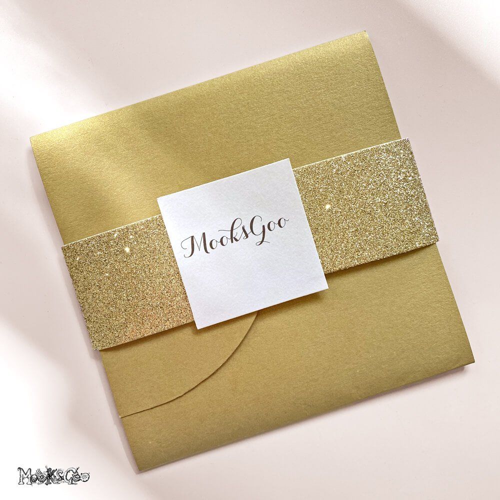 Gold folded envelope with a wedding invitation inside, designed by MooksGoo