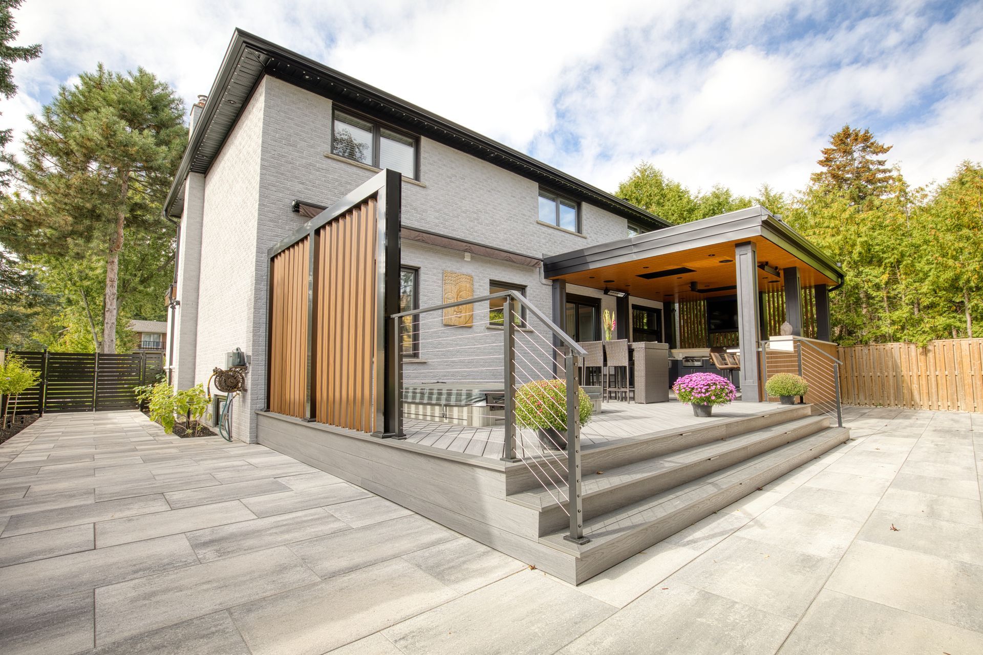 A large house with a porch and a walkway leading to it.