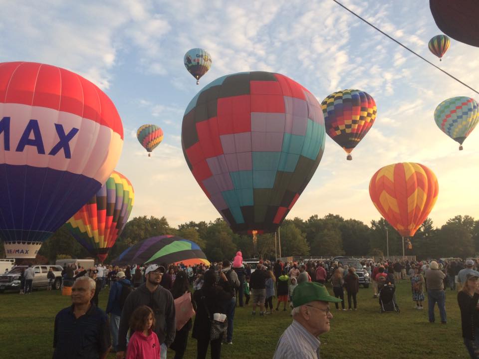 people enjoying  hot air balloons