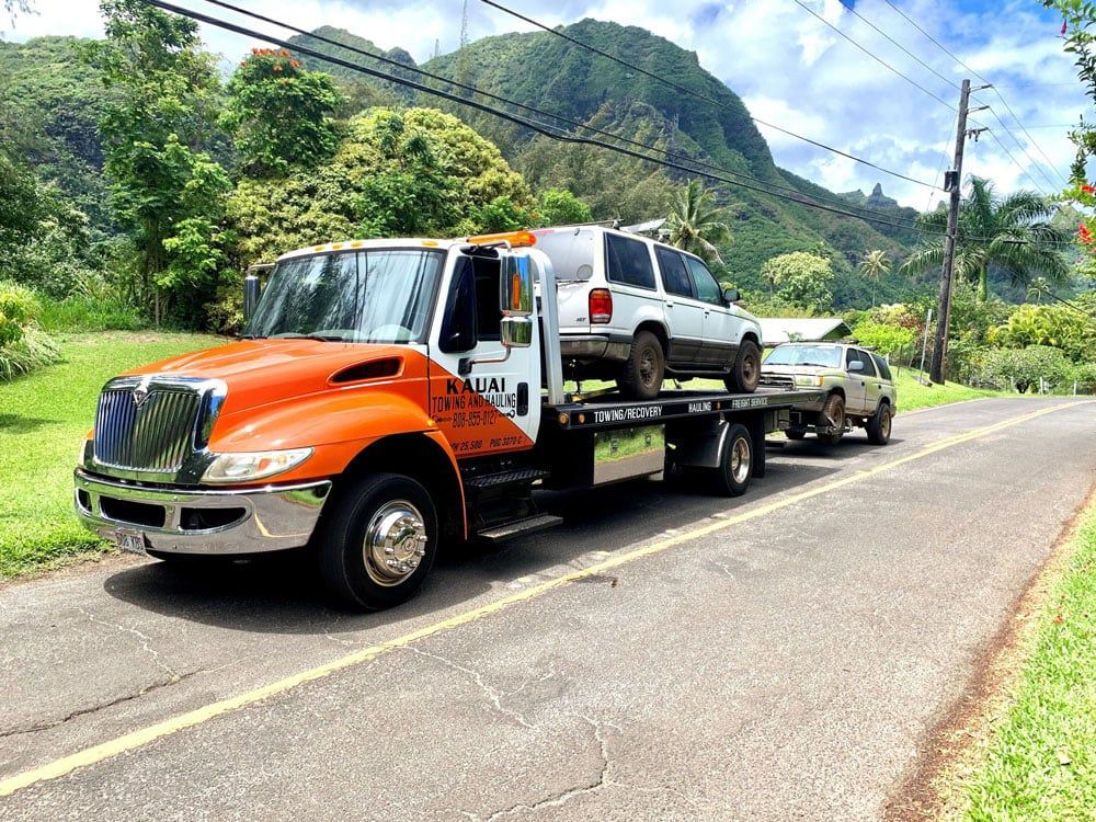 Kauai Towing and Hauling truck with broken down cars