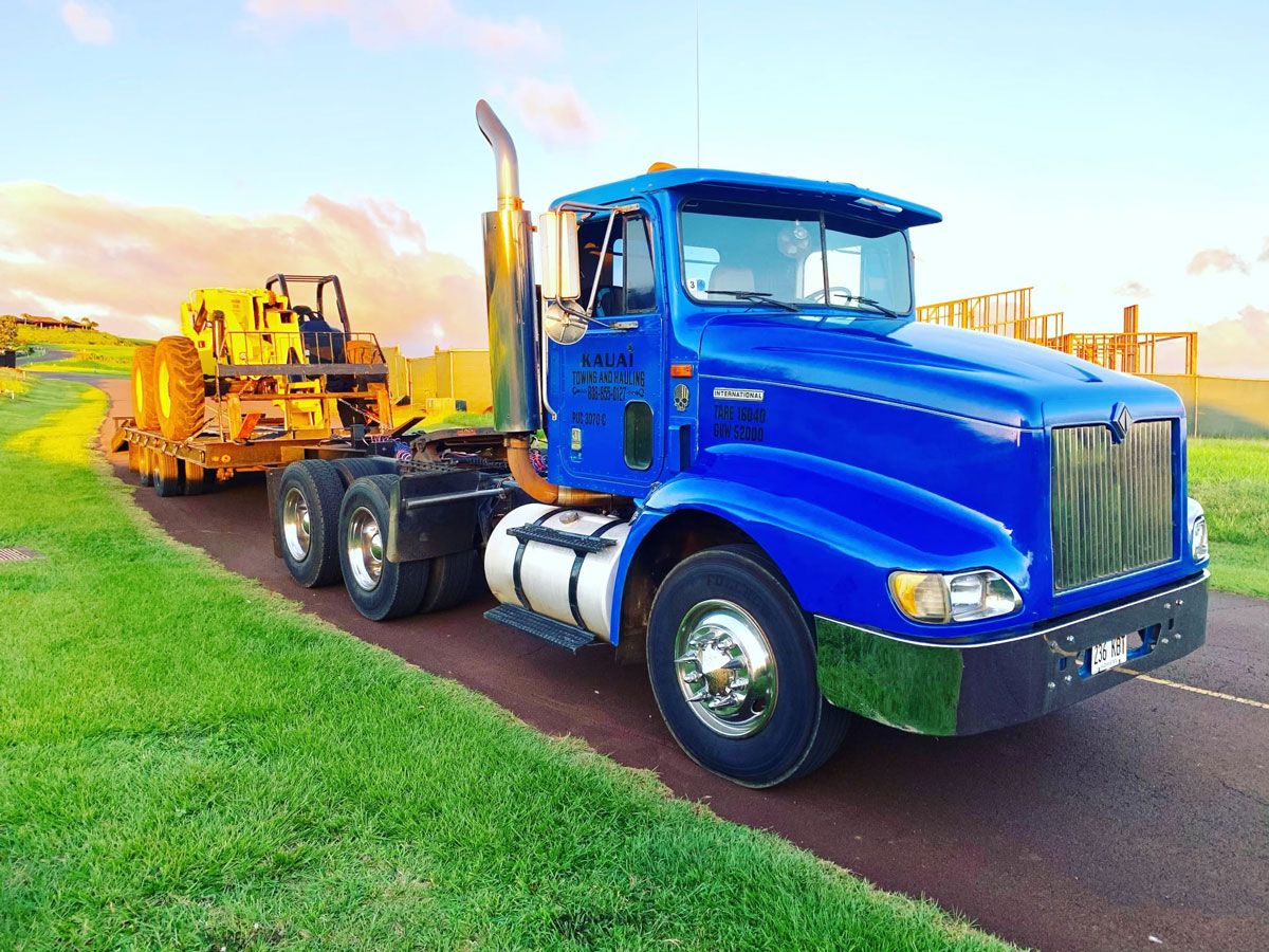 semi trailer hauling construction machinery
