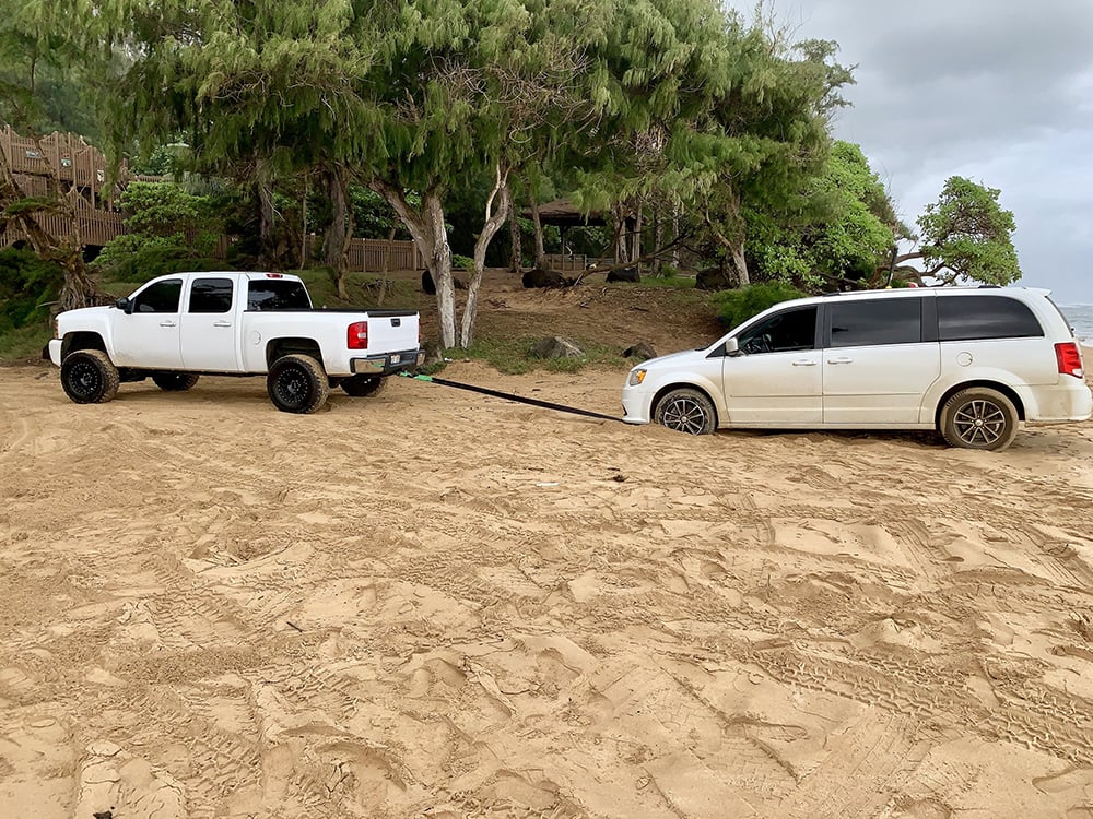 truck pulling out a stuck vehicle
