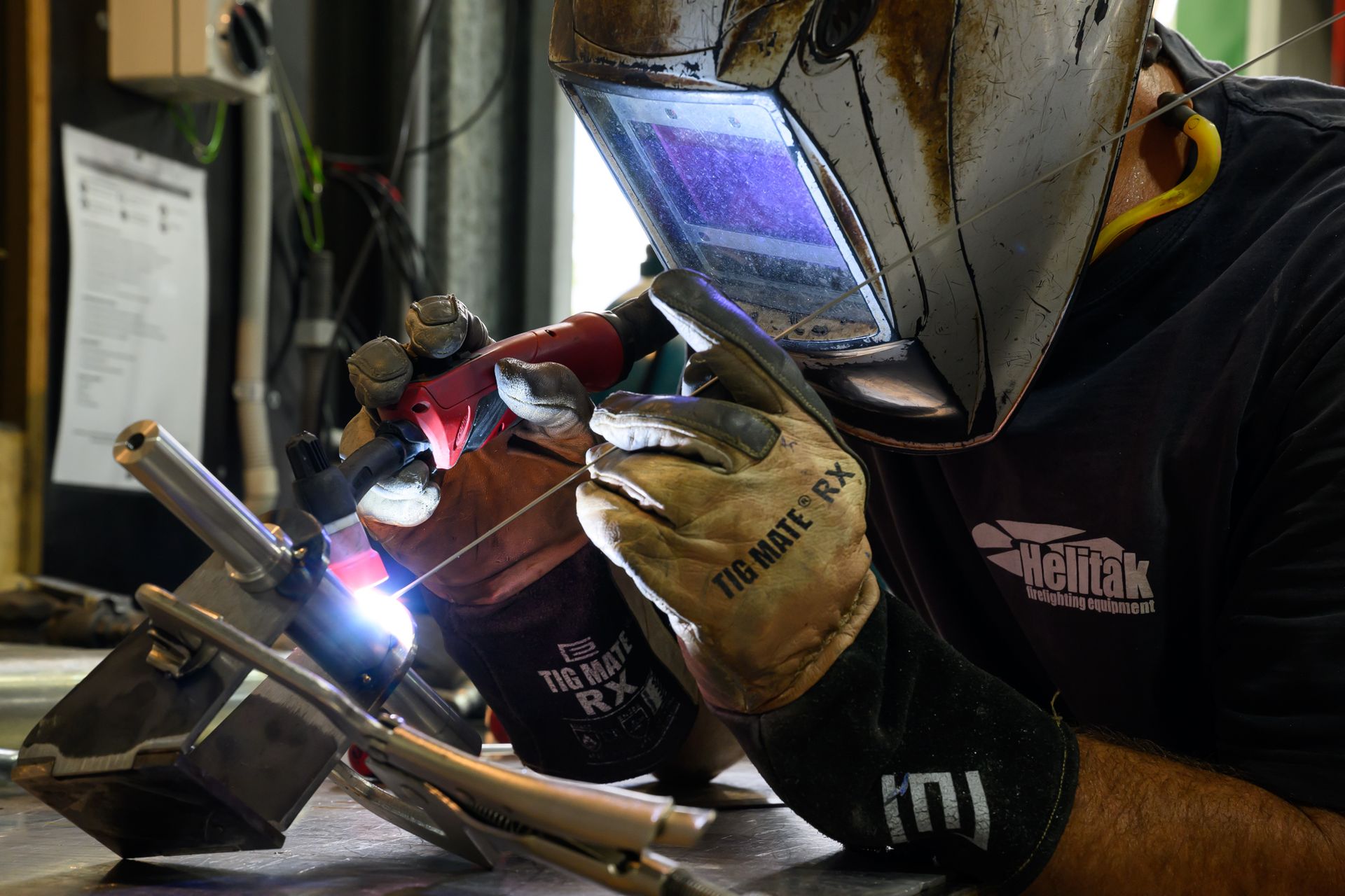 worker sewing helitak