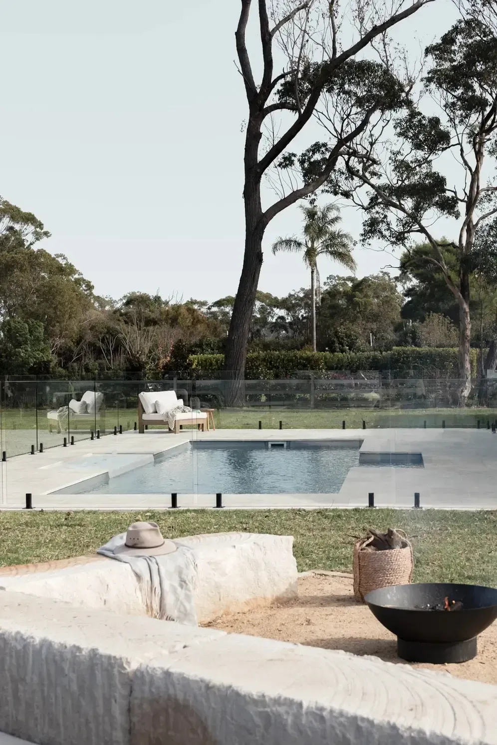 A Swimming Pool Is Surrounded by A Fence — Billabong Pool Co in Smeaton Grange, NSW