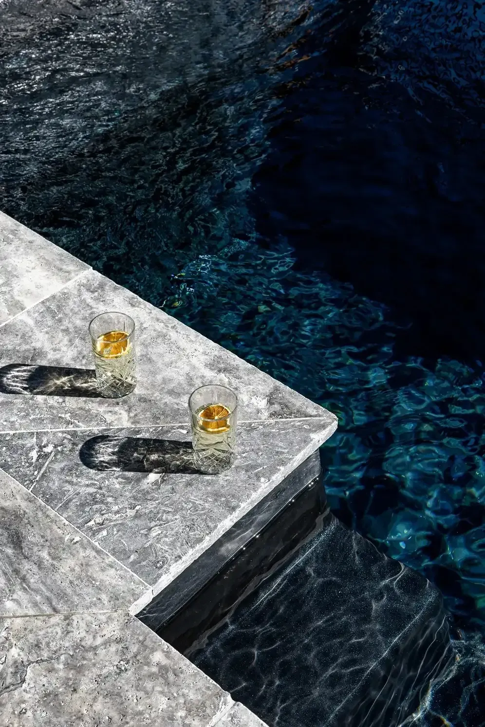 Two Glasses of Whiskey Are Sitting on A Ledge — Billabong Pool Co in Smeaton Grange, NSW