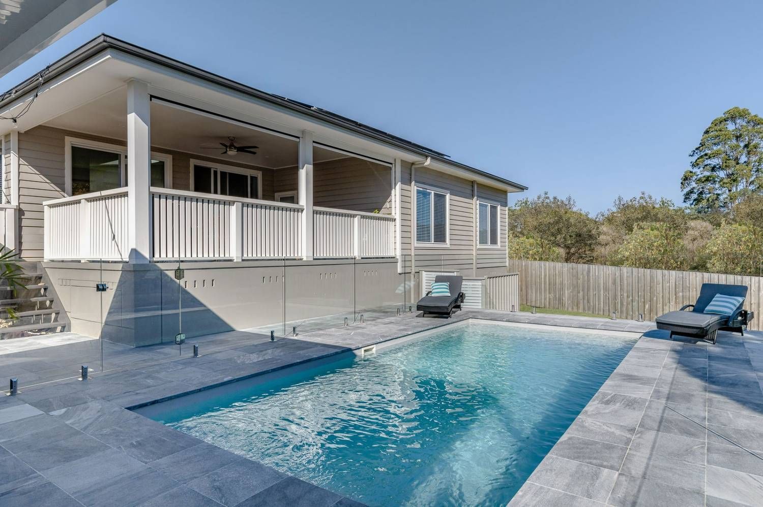 A House with A Swimming Pool in Front of It — Billabong Pool Co in Smeaton Grange, NSW