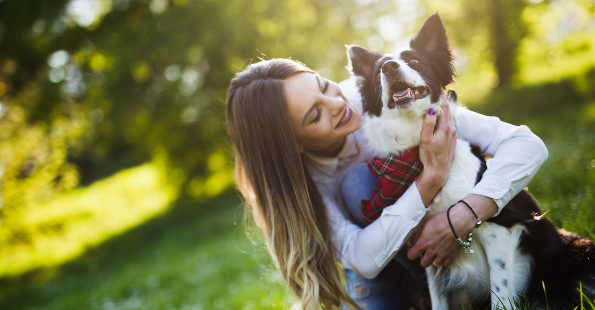woman holding her dog