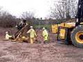 A group of construction workers are working on a construction site.