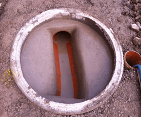 A concrete circle with a hole in the middle of it