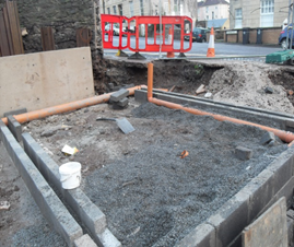 A construction site with a red barrier in the background