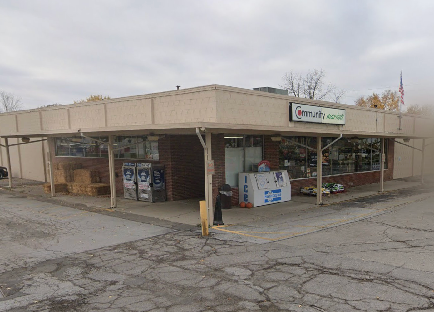 Brick building with tan overhang.