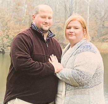 A Couple Smiling Together. Shop Wedding Registries at McAdams' Ltd., a Gift Store in Columbia, MO.