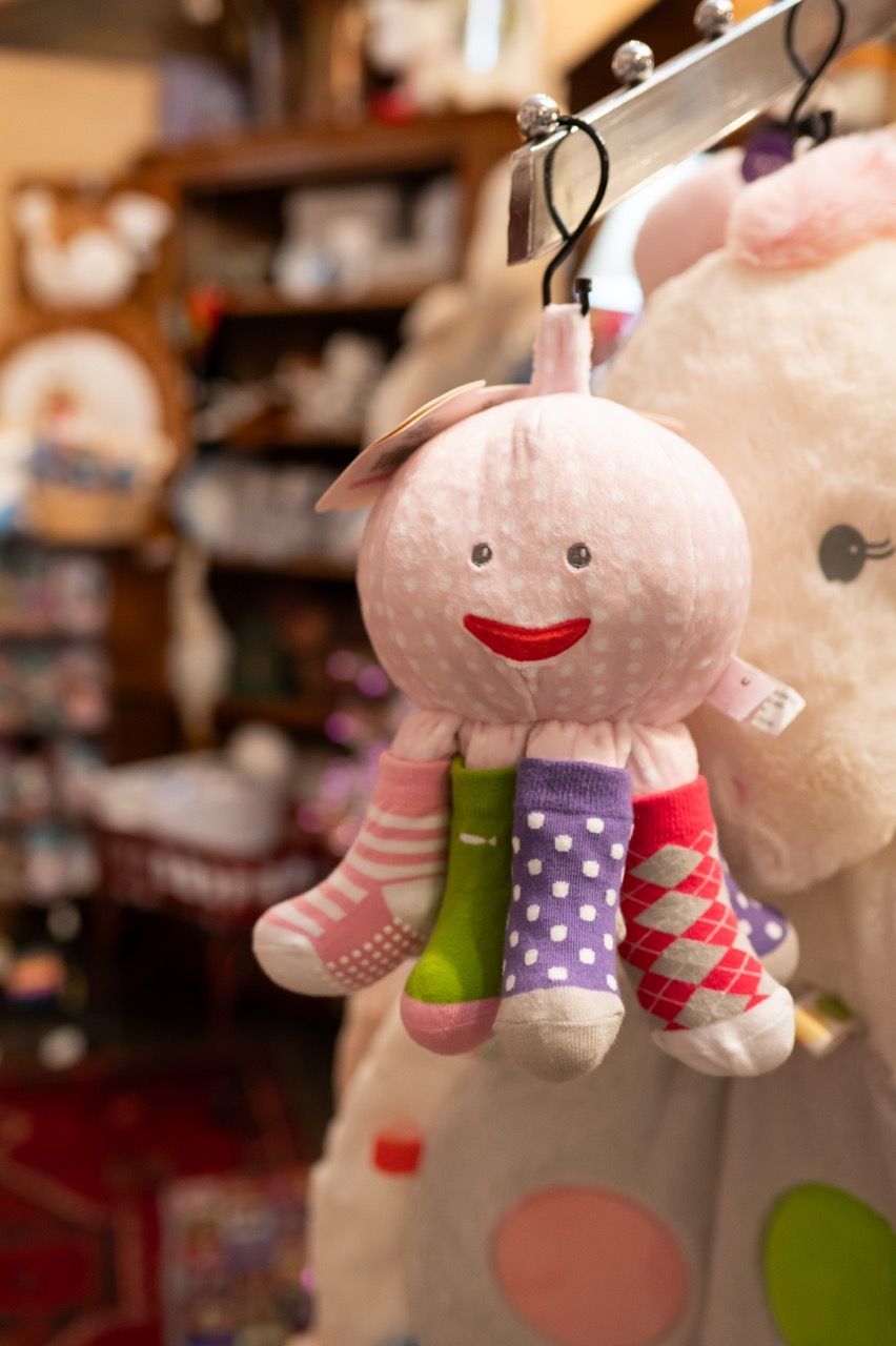 A Stuffed Octopus Wearing Socks. Buy Great Baby Gifts From McAdams Gift Store in Columbia, MO.