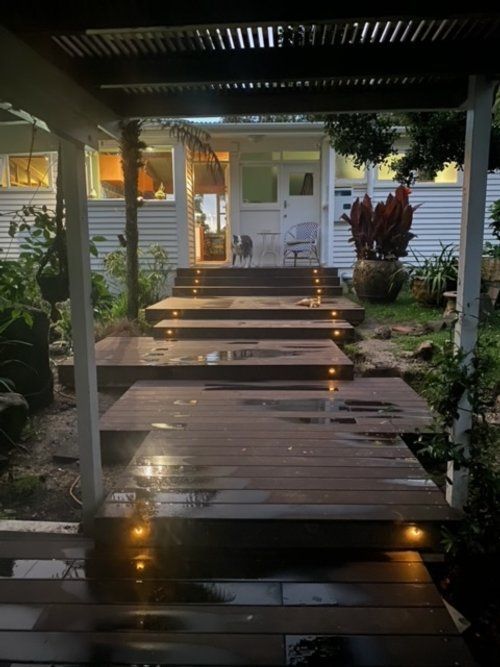 Wooden Deck With Stairs Leading Up To House — Auckland, NZ — Serenity Landscapes Wooden Deck With Stairs Leading Up To House — Auckland, NZ — Serenity Landscapes