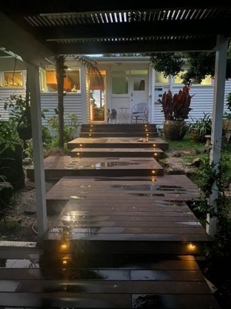Wooden Deck With Stairs Leading Up To House — Auckland, NZ — Serenity Landscapes