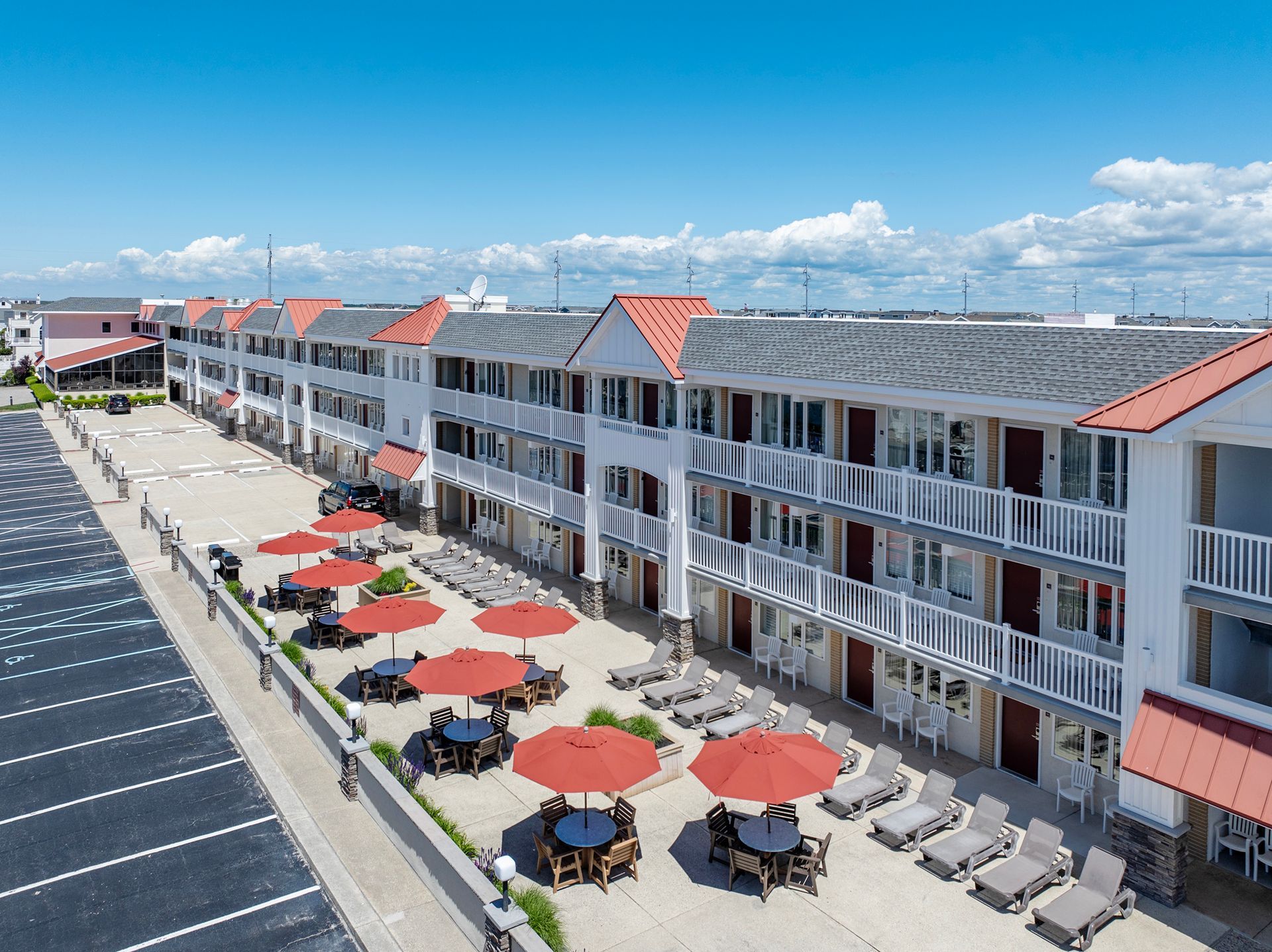 image of patio with tables and  umbrellas