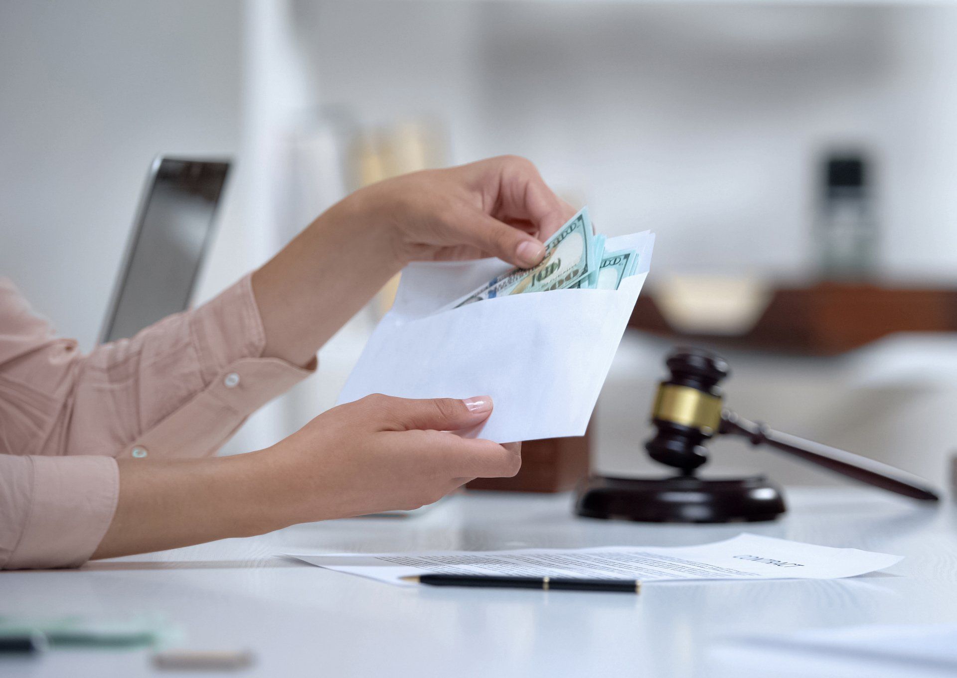 Woman Holding an Envelope with Money — Sebring, FL — Copley Law Firm