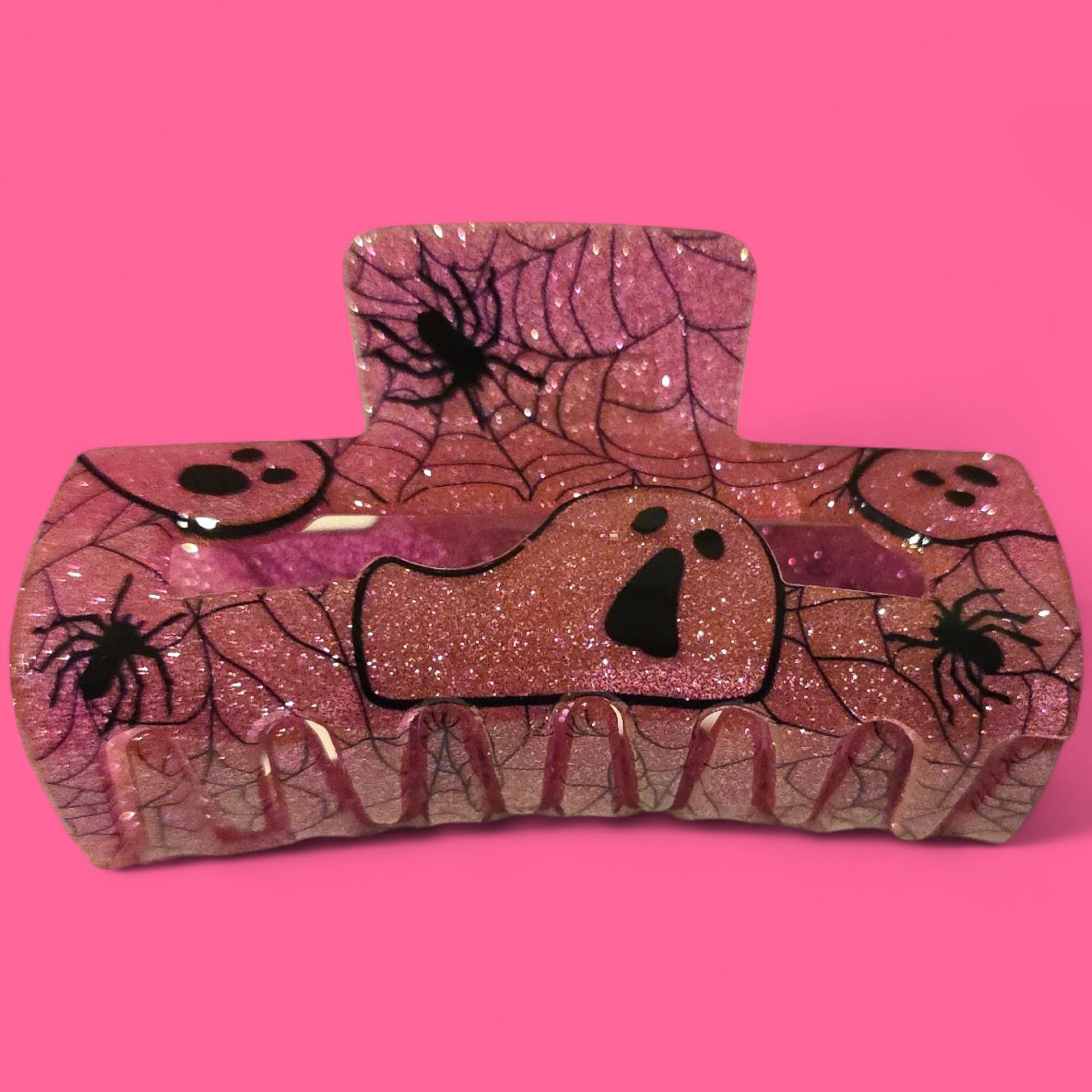 Pinza para el pelo rosa con purpurina, decorada con telarañas, arañas, fantasmas y caras redondas.