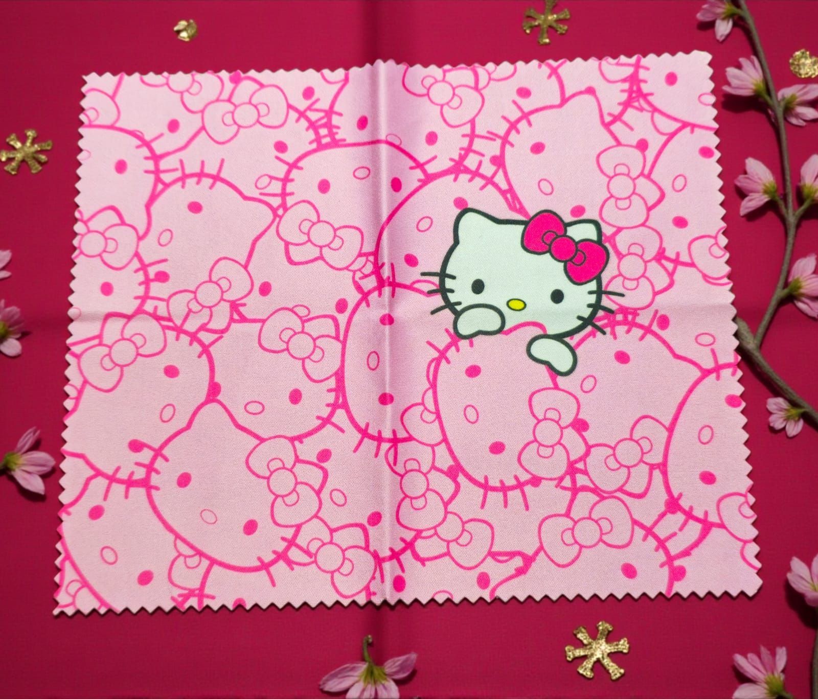 Tela rosa de Hello Kitty con patrón repetido, cara en el centro.