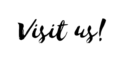 Black script text reading “Visit us!” on a white background.