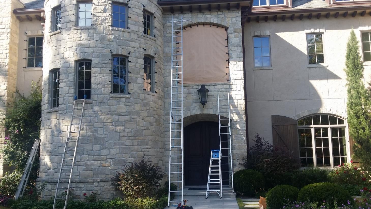 A window with wooden shutters on a brick wall