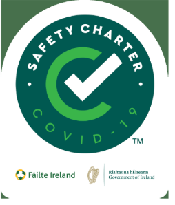 A green safety charter logo with a check mark