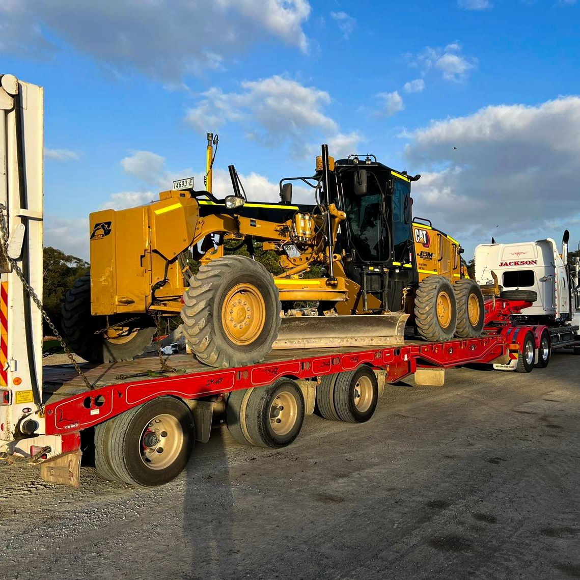 A Construction Worker Stands Before a Building Under Construction — Earthmoving in Maitland, NSW