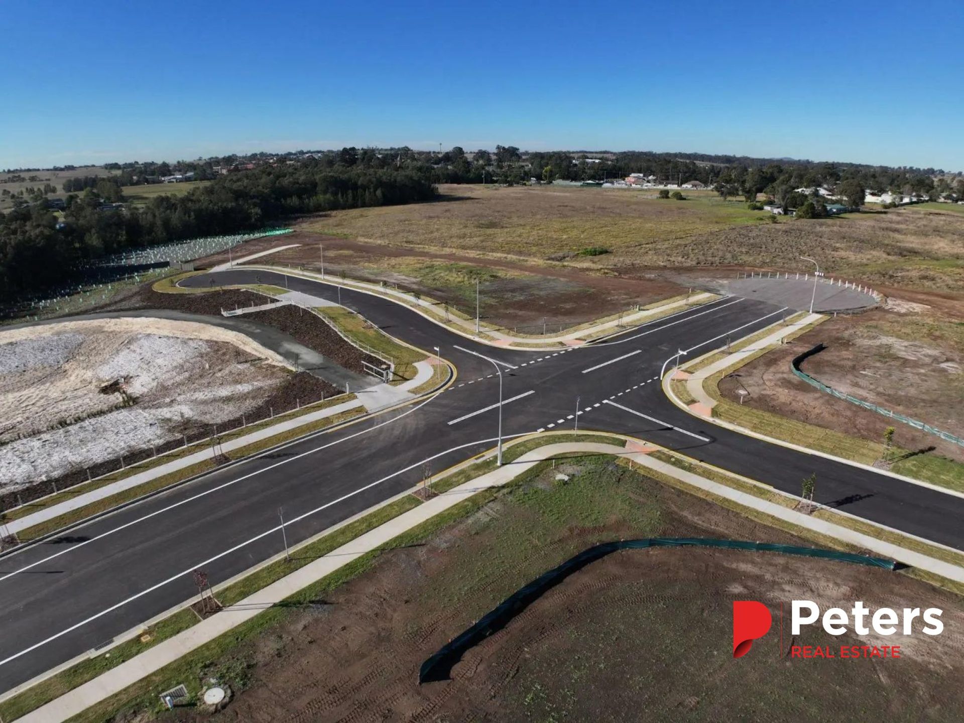 Aerial View of New Roads and Intersection in a Field Under a Clear Blue Sky — Earthmoving in Maitland, NSW