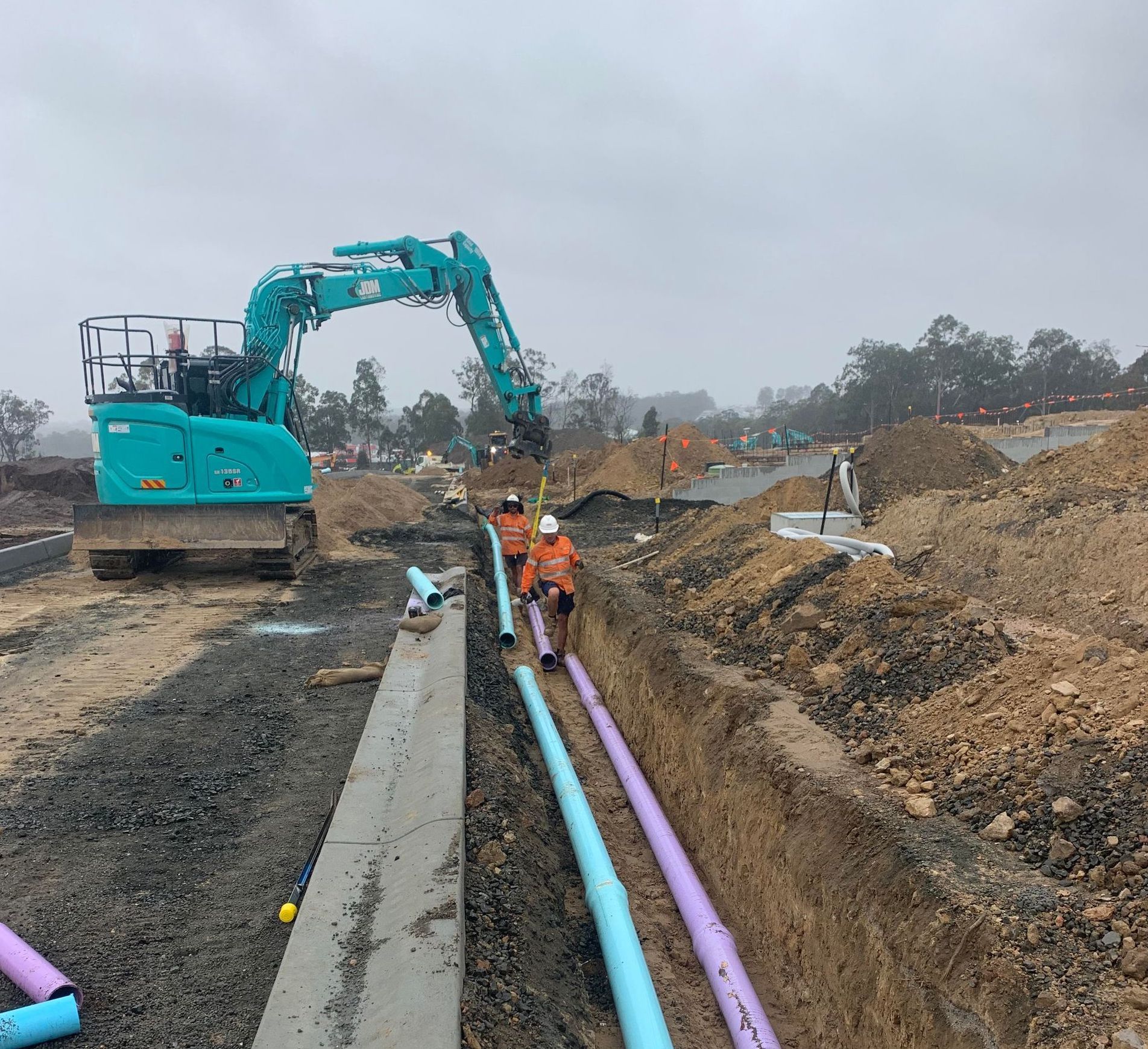 Yellow Excavator is Cutting Down Trees in a Forest — Civil Construction in Newcastle, NSW