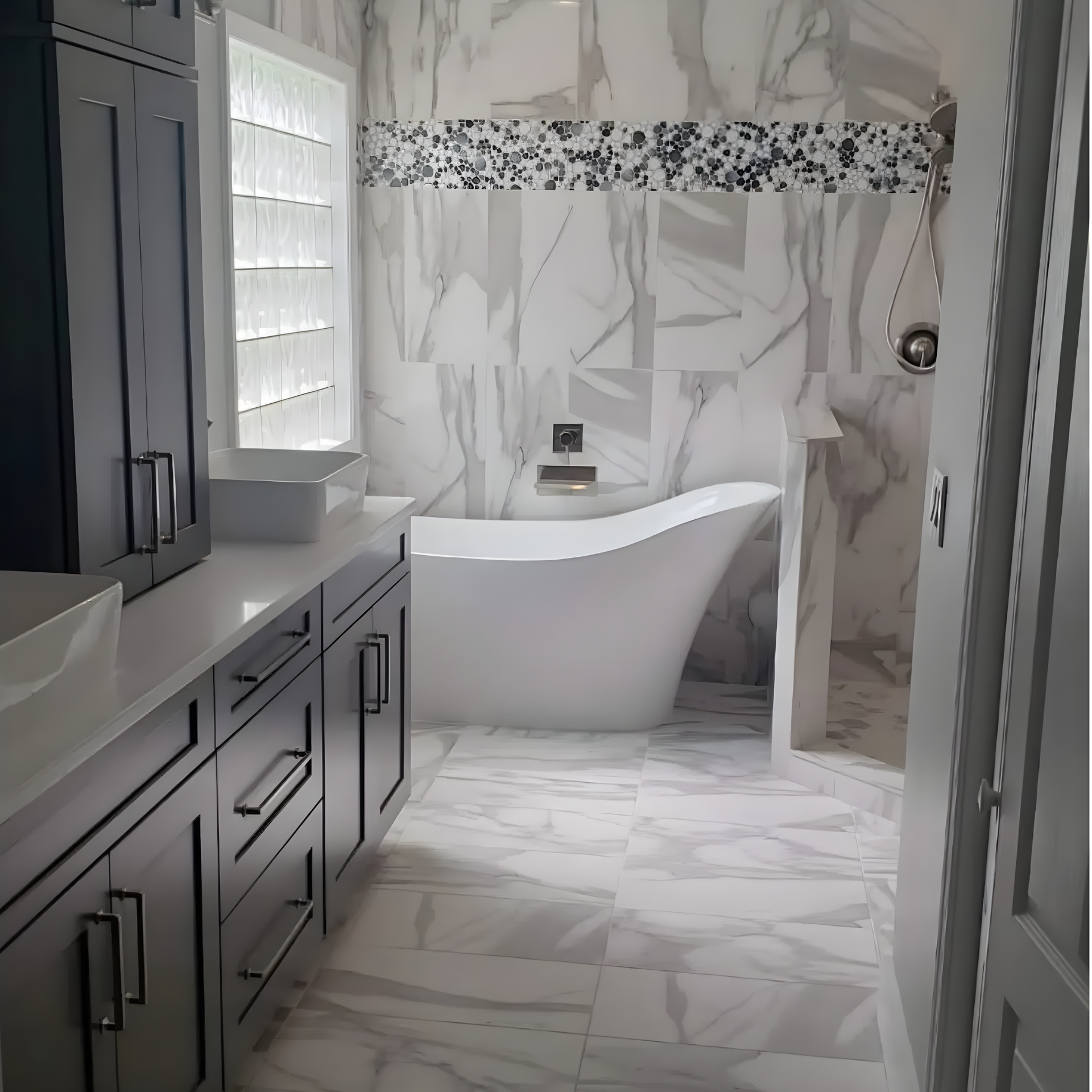Bathroom with dual sinks, shower, and dark granite countertops.