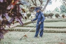 professional weed-eating a front yard