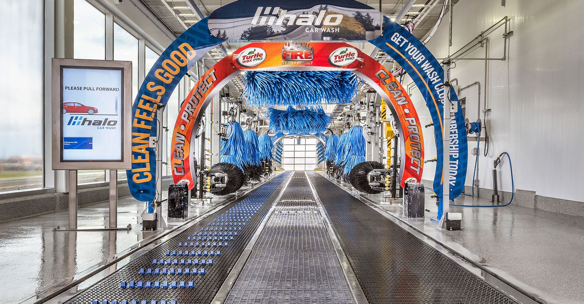 A car wash with a sign that says `` clean feels good ''.