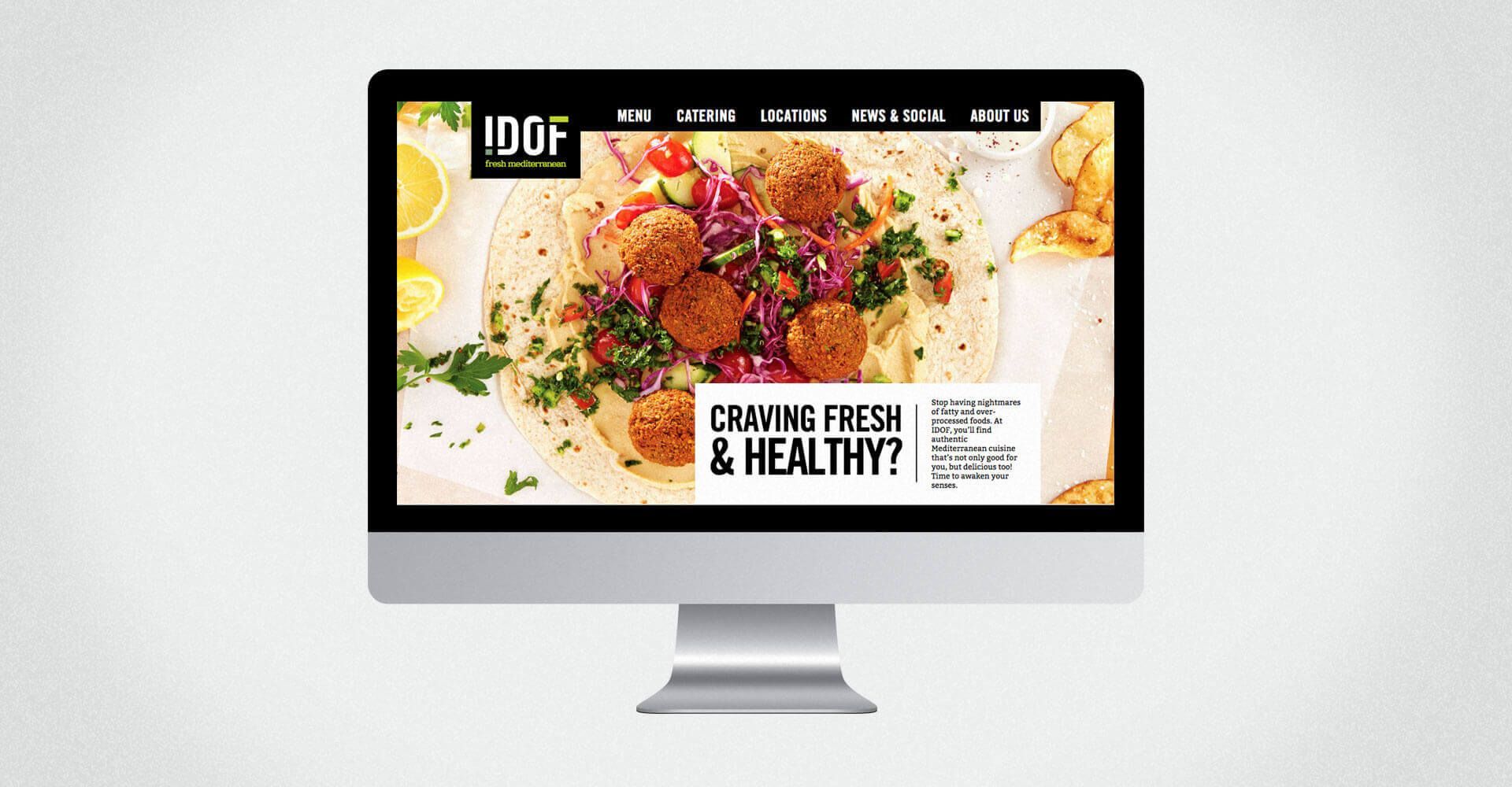 A computer monitor with a picture of food on the screen.