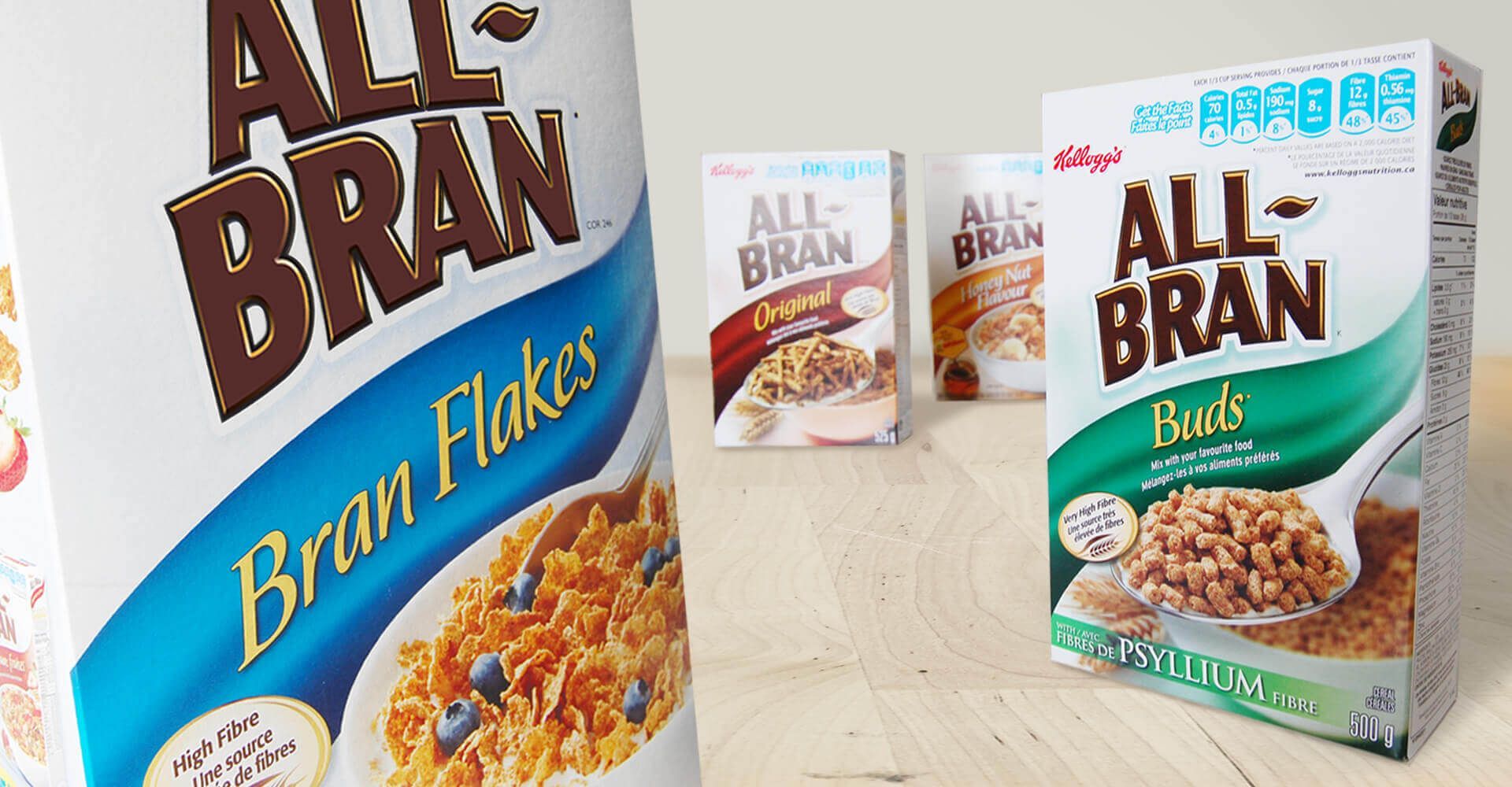 Three boxes of all bran cereal are on a table
