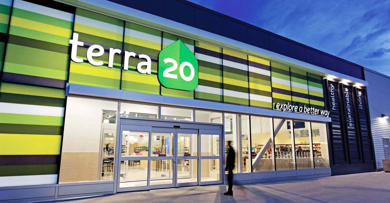 A person is walking in front of a terra 20 store