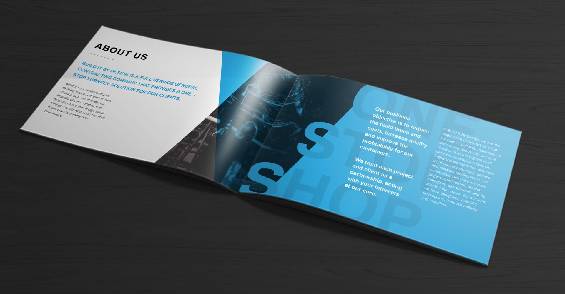A blue and white brochure is sitting on a black table.