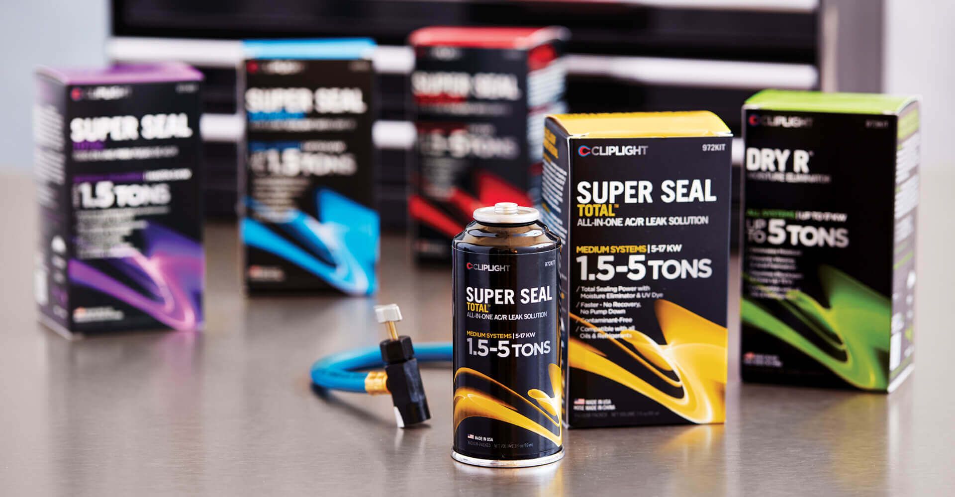 A group of bottles and boxes of super seal on a table.
