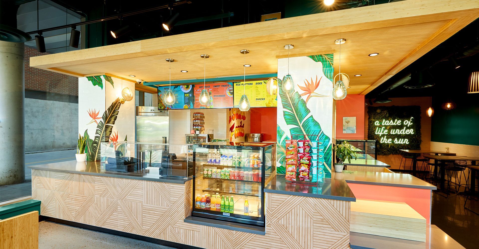 A restaurant with a large counter and a display case.