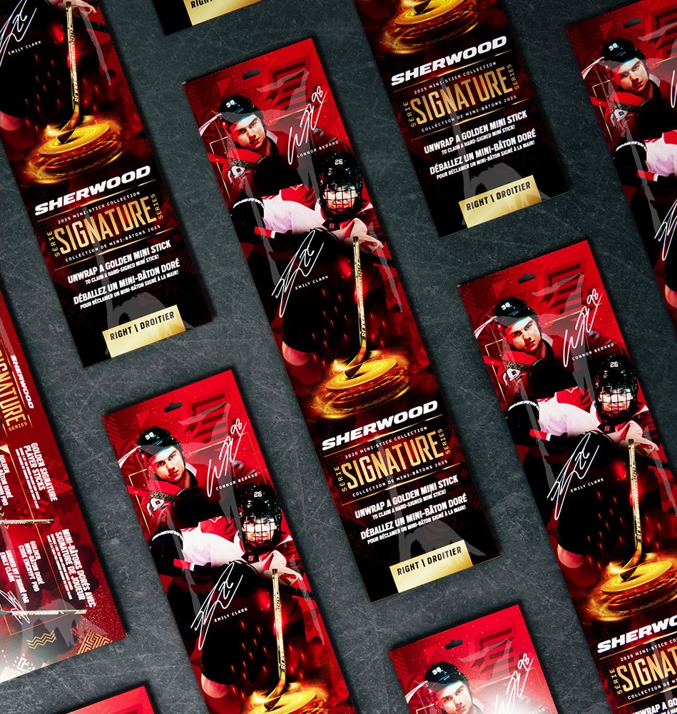 A bowl of sauce surrounded by garlic , lemongrass , onions , and red pepper.