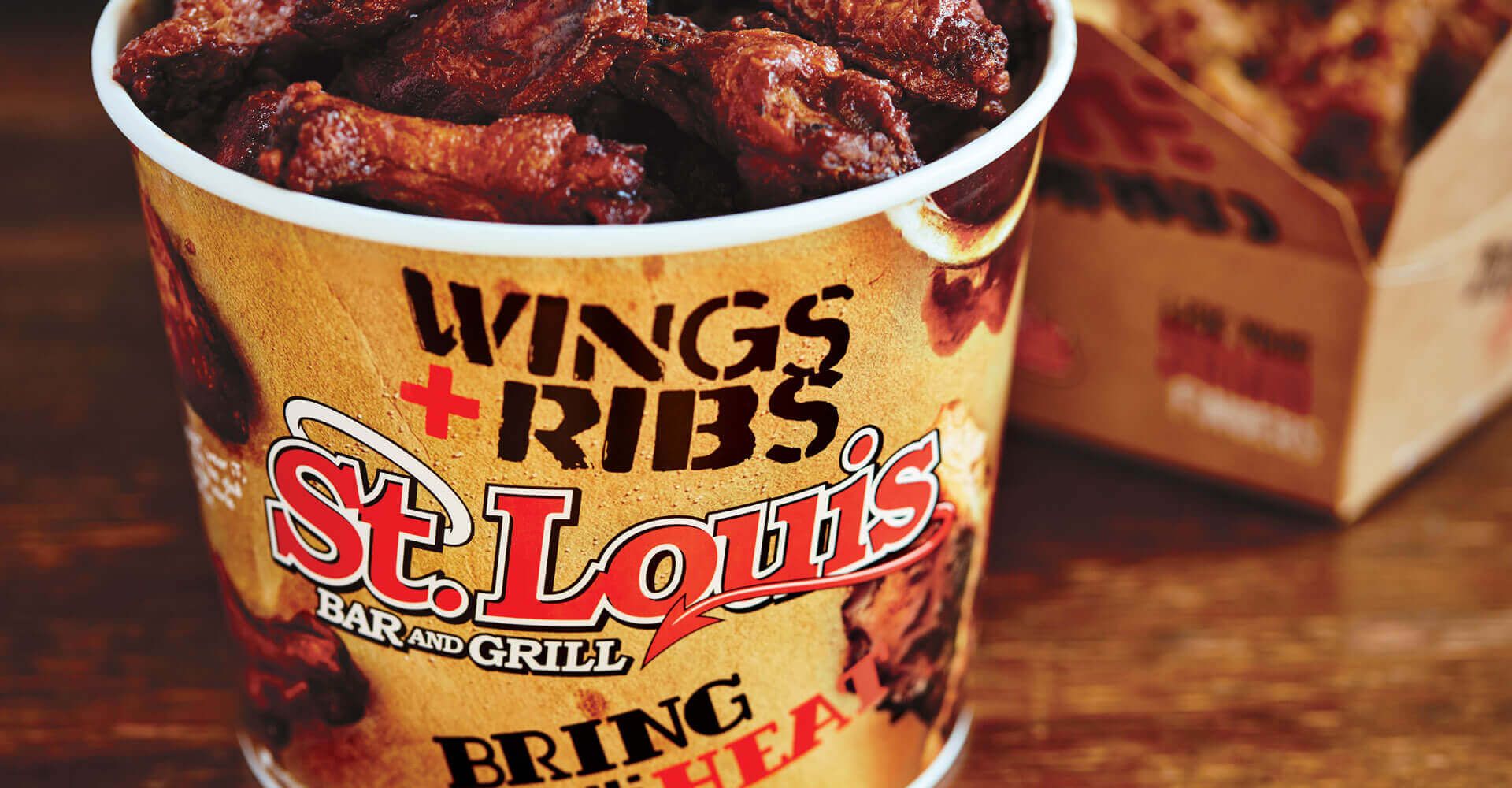A bucket of wings and ribs from st. louis
