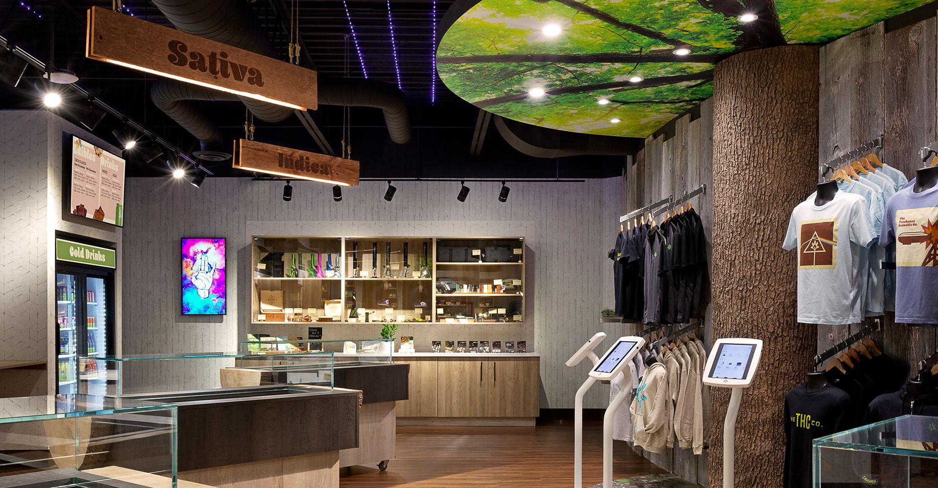 A store filled with lots of clothes and a sign that says sativa.