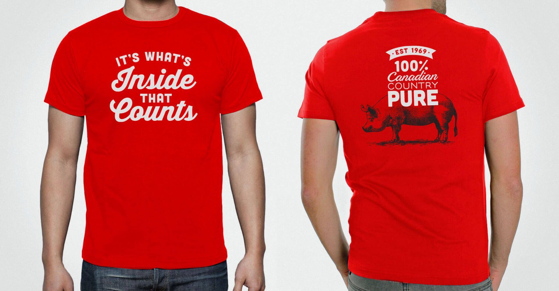 A man is wearing a red t-shirt that says it 's what 's inside that counts