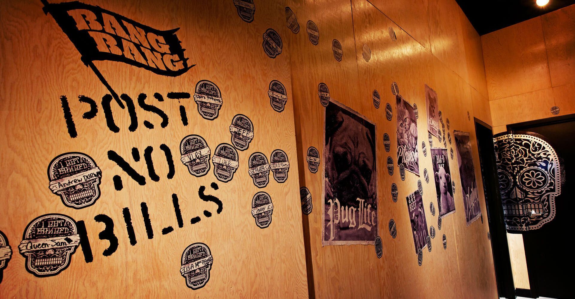 A sign on a wall that says post no bills