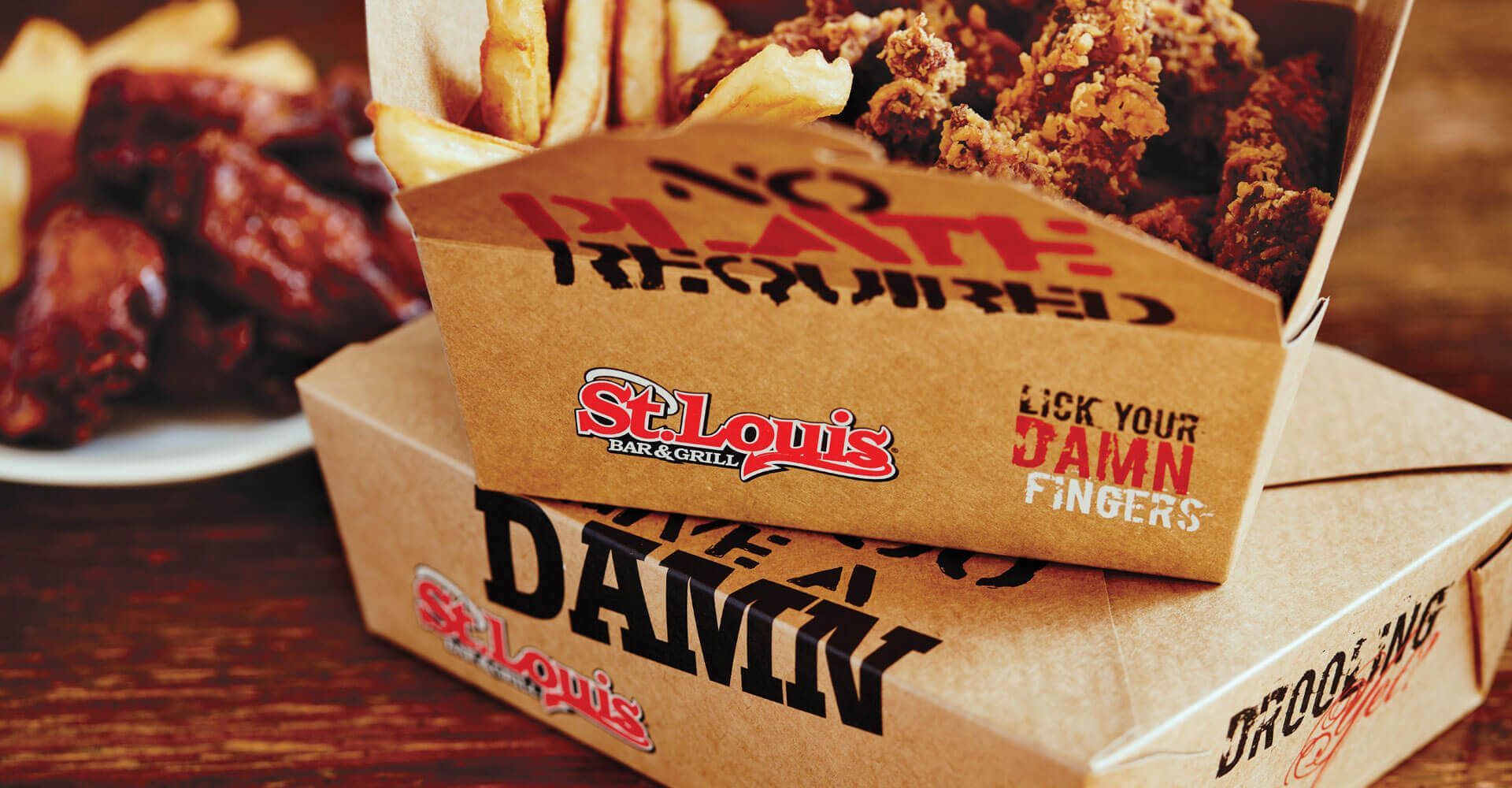 fries and chicken in a take out box