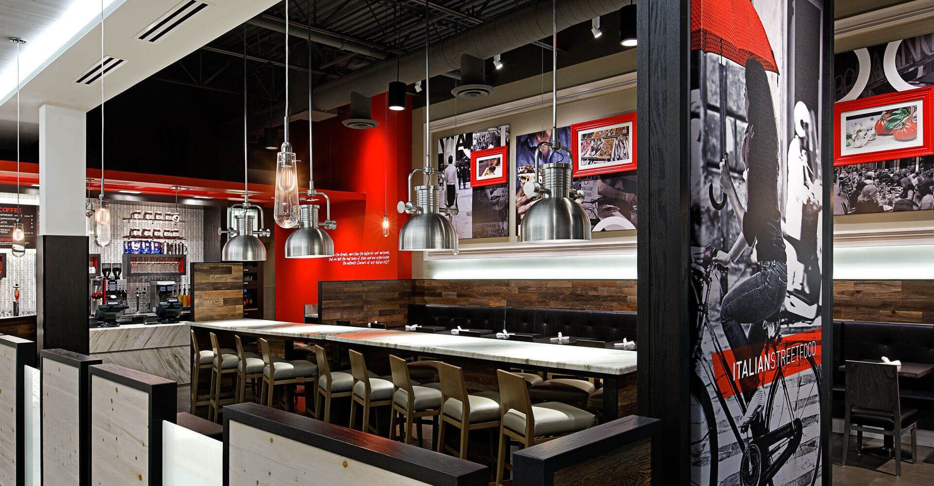 A restaurant with a long table and chairs in it
