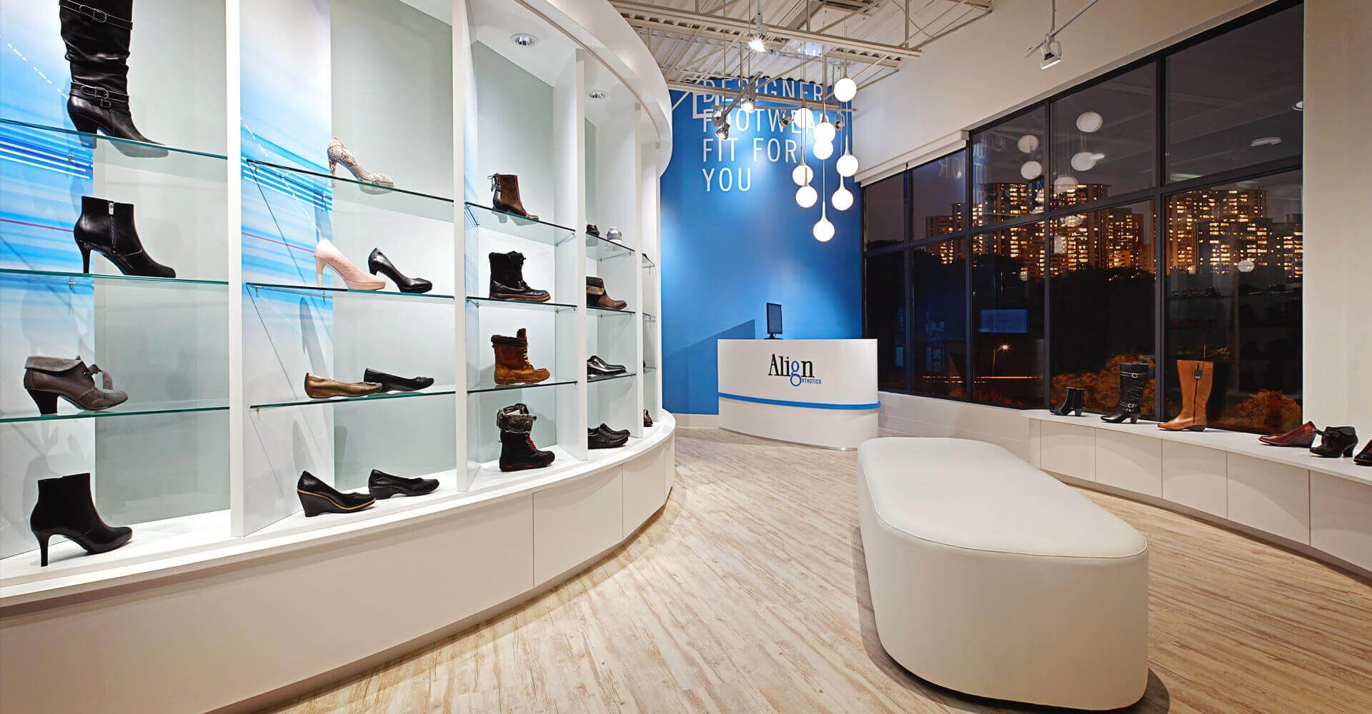 A shoe store with a lot of shoes on shelves
