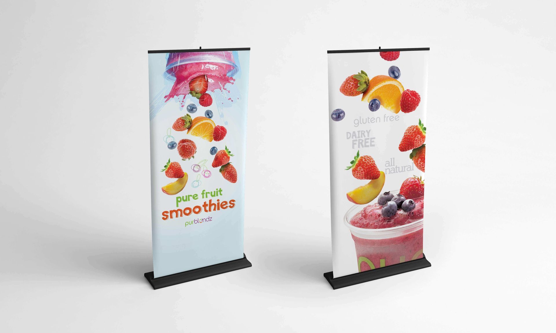 Two banners with fruit on them are sitting next to each other on a table.