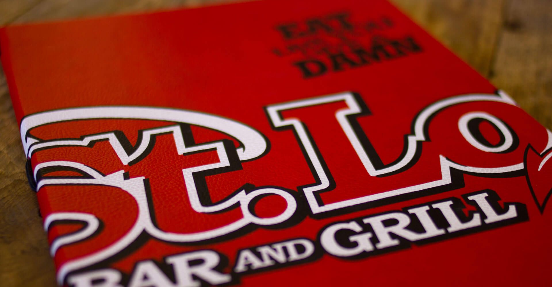 A close up of a menu for a restaurant called elo bar and grill