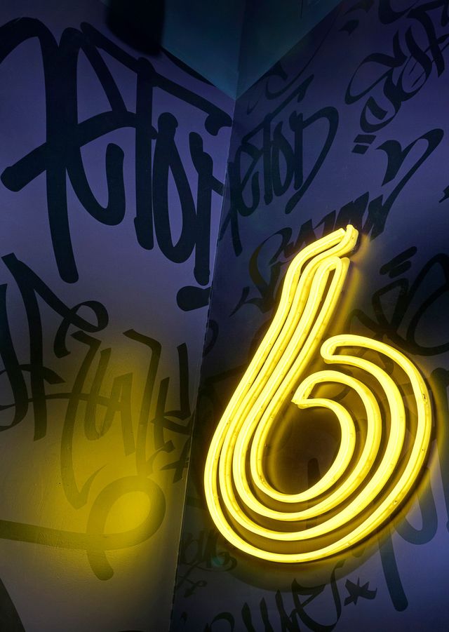 A neon sign with the number 6 on it